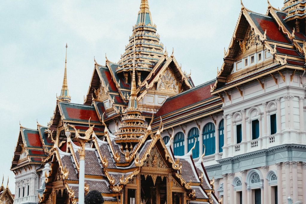 Ornate Thai architecture with golden details at Bangkok's Grand Palace.